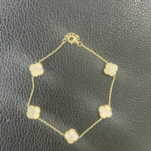 Bracelet with 5 white flowers. Size 7 and extension 8'' 14K